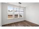 Bright dining area with a modern chandelier and large windows overlooking the backyard at 3113 Petrea Ct # 38, Angier, NC 27501