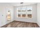Inviting dining room with door access and a large window offering natural light and backyard views at 3113 Petrea Ct # 38, Angier, NC 27501