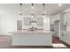 Stylish kitchen with granite counters, stainless appliances, and center island with pendant lights at 3113 Petrea Ct # 38, Angier, NC 27501