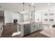 Open kitchen with stainless steel appliances, granite countertops, and view into the living area at 3113 Petrea Ct # 38, Angier, NC 27501