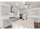 Well-appointed kitchen with stainless steel appliances, granite island, and pendant lighting at 3113 Petrea Ct # 38, Angier, NC 27501