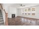 Spacious living room features wood floors, fireplace, large windows, and ceiling fan at 3113 Petrea Ct # 38, Angier, NC 27501