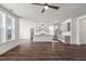 Open-concept living area and kitchen featuring hardwood floors, abundant natural light, and stylish modern fixtures at 3113 Petrea Ct # 38, Angier, NC 27501