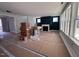 Unfinished living room with neutral wall color, a fireplace and many windows allowing natural light to enter at 3113 Petrea Ct # 38, Angier, NC 27501