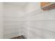 Spacious walk-in pantry featuring multiple levels of white wire shelving for ample storage at 3113 Petrea Ct # 38, Angier, NC 27501