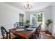 Formal dining room featuring hardwood floors, large windows, and stylish furnishings at 135 Deep Creek, Rougemont, NC 27572