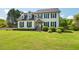 Charming two-story home with a well-manicured lawn and inviting front porch at 135 Deep Creek, Rougemont, NC 27572