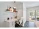 Built in home office space features built in shelving and an adjacent glass door overlooking the patio at 135 Deep Creek, Rougemont, NC 27572