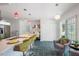 Bright kitchen with stainless steel appliances, stylish pendant lighting, breakfast bar, and a cozy sitting area at 135 Deep Creek, Rougemont, NC 27572