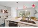 Bright kitchen with a countertop overlooking the patio at 135 Deep Creek, Rougemont, NC 27572