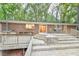 Multi-level back deck provides outdoor living space and access to the brick home and wooded backyard at 128 Dixie Dr, Chapel Hill, NC 27514