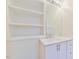Bathroom featuring a vanity with shaker-style doors and a framed mirror at 128 Dixie Dr, Chapel Hill, NC 27514