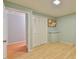 Bedroom featuring a closet with louvered doors and light hardwood floors at 128 Dixie Dr, Chapel Hill, NC 27514