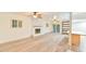 Living room featuring a fireplace, sliding door, and an island with seating at 128 Dixie Dr, Chapel Hill, NC 27514