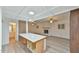 Open concept living room with an island and light gray wood flooring at 128 Dixie Dr, Chapel Hill, NC 27514