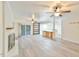 Living room featuring a fireplace, sliding door, and an island with seating at 128 Dixie Dr, Chapel Hill, NC 27514