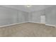 Finished basement with neutral carpet flooring, light-colored walls, and an access panel at 3109 Petrea Ct # 39, Angier, NC 27501