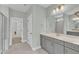 Bright bathroom with light gray vanity, dual sinks, walk-in shower, and neutral-colored walls at 3109 Petrea Ct # 39, Angier, NC 27501