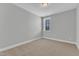 Neutral bedroom with a light color palette, carpet flooring, and bright window at 3109 Petrea Ct # 39, Angier, NC 27501