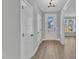 Bright hallway with wood-look floors, white trim, and natural light, creating a welcoming entrance at 3109 Petrea Ct # 39, Angier, NC 27501