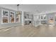 Bright, open kitchen and dining area with gray cabinets, granite counters, and modern lighting at 3109 Petrea Ct # 39, Angier, NC 27501