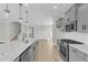 Bright, open kitchen with granite countertops, stainless steel appliances and stylish pendant lighting at 3109 Petrea Ct # 39, Angier, NC 27501