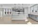 Spacious kitchen featuring gray cabinets, granite countertops, pendant lighting, and modern appliances at 3109 Petrea Ct # 39, Angier, NC 27501