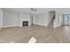 Inviting living room with fireplace, wood-look flooring, and staircase access to the upper level at 3109 Petrea Ct # 39, Angier, NC 27501