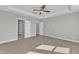 A spacious main bedroom features neutral walls, carpet flooring and a ceiling fan at 3109 Petrea Ct # 39, Angier, NC 27501