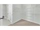 Spacious walk-in closet with wire shelving and neutral-colored walls at 3109 Petrea Ct # 39, Angier, NC 27501