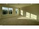 Bright, carpeted bedroom with two windows offering great views and plenty of natural light at 490 Traditions Grande Blvd # 27, Wake Forest, NC 27587