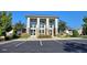 Beautiful clubhouse featuring stately columns and a well-manicured flower bed, offering a welcoming and refined space at 490 Traditions Grande Blvd # 27, Wake Forest, NC 27587