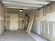 Spacious garage with unfinished walls, providing ample storage and parking space at 490 Traditions Grande Blvd # 27, Wake Forest, NC 27587