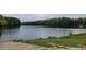 Scenic lakefront view offering a serene and picturesque backdrop, ideal for relaxation and outdoor enjoyment at 490 Traditions Grande Blvd # 27, Wake Forest, NC 27587
