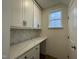 Bright office space features built-in white cabinets, marble countertops, and a window for natural light at 490 Traditions Grande Blvd # 27, Wake Forest, NC 27587