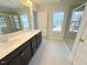 Spacious bathroom with double sink vanity, walk-in shower, and tile floors at 9229 Kitchin Farms Way # 427, Wake Forest, NC 27587