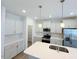 Modern kitchen with stainless steel appliances and a large island with sink at 9229 Kitchin Farms Way # 427, Wake Forest, NC 27587