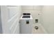 Laundry room with tile floor, utility hookups, and modern washing machine at 9229 Kitchin Farms Way # 427, Wake Forest, NC 27587
