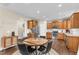 Modern kitchen with wood cabinets, stainless steel appliances, and granite countertops at 220 Clubhouse Dr, Youngsville, NC 27596