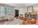 Living room with hardwood floors and built-in shelving units at 220 Clubhouse Dr, Youngsville, NC 27596