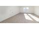 Spacious bonus room with neutral carpeting and window at 87 Lupin Dr, Smithfield, NC 27577