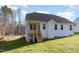 White house exterior with gray roof, wooden stairs, and a partially visible deck at 87 Lupin Dr, Smithfield, NC 27577