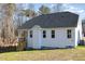 White house exterior with gray roof, wooden stairs, and a partially visible deck at 87 Lupin Dr, Smithfield, NC 27577