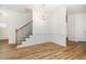 Bright dining room with hardwood floors, chandelier, and wainscoting at 90 Trescott St, Smithfield, NC 27577