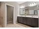 Double vanity bathroom with dark brown cabinets at 113 Pinot Ct, Chapel Hill, NC 27517