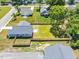Aerial view of a home with a fenced backyard and a concrete patio pad, set in a neighborhood at 306 E Godwin St, Dunn, NC 28334