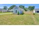 Charming home featuring a lush backyard with a privacy fence and healthy lawn at 306 E Godwin St, Dunn, NC 28334