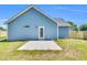 Back exterior featuring a fenced-in backyard and a newly installed concrete patio at 306 E Godwin St, Dunn, NC 28334