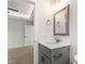 Bathroom featuring a grey vanity with a framed mirror at 306 E Godwin St, Dunn, NC 28334