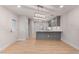 Spacious kitchen featuring grey cabinets, stainless steel appliances, and modern pendant lights at 306 E Godwin St, Dunn, NC 28334